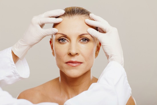 Photo Of A Woman Having Her Face Inspected Before Cosmetic Surgery - Premier Plastic Surgery & Dermatology